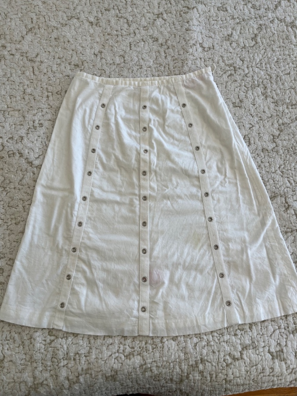 Summery white A-line skirt with grommet detail